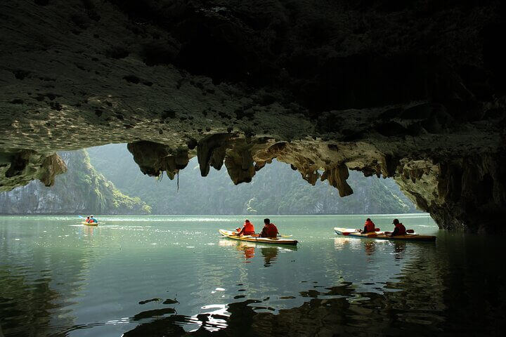 Dark cave visit by kayak